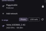 Wi-Fi tab. The link card on top, saved networks, then what is in range. Neighbour network names are blurred.